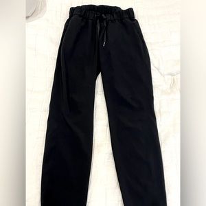 Black Lulu lemon leisure pants.